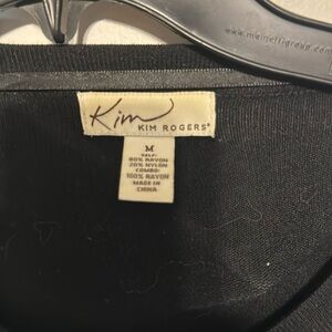 Kim Rogers knit black short cardigan with ruffles.